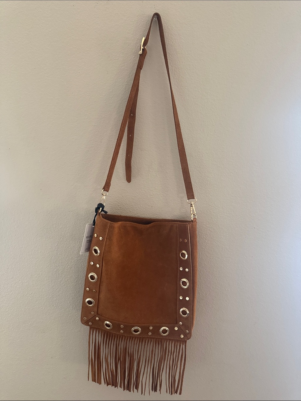 Tan Suede Fringe Crossbody Bag with Grommet Accents